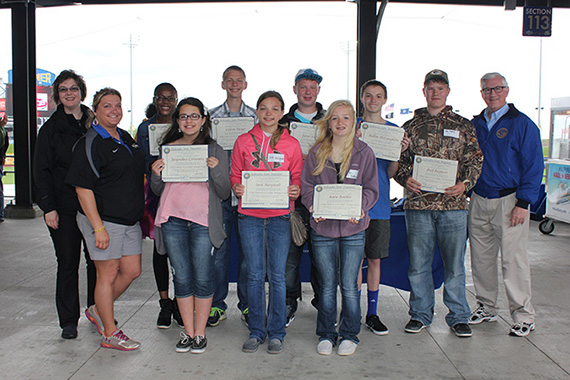 Treasurer Don Stenberg, far right, shown with winners of contest at Werner Park in Papillion. From left, Rachel Biar, director of college savings; Andrea Stava, assistant general manager of operations for the Omaha Storm Chasers; Priscilla Lebesse, Lincoln; Jacqueline Cervantes, Papillion; Colton Meyer, Eagle; Andi Bargstadt, Winside; Jared Nielsen, Walton; Katie Bathke, Dixon; Kellen McLaughlin, Omaha; and Raif Ruppert, Taylor.