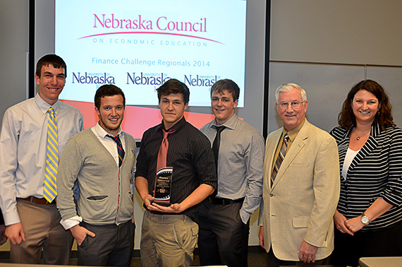 Norris High School winning team members, from left Terrell Rose, Cameron Walker, Cole Johnson, and Nolan Graham with State Treasurer Don Stenberg and Jennifer Davidson with the Nebraska Council on Economic Education.