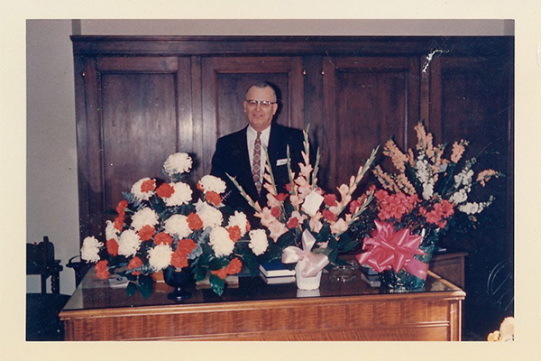 The late Clarence Swanson in the State Treasurer’s Office with congratulatory bouquets after his election to office.