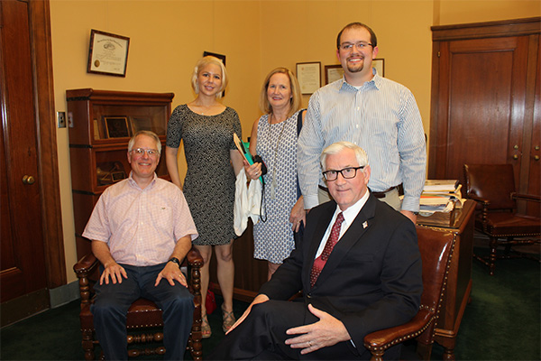 Treasurer Stenberg with Dr. Sven Swanson, seated, of Athens, Georgia, and his family. From left, daughter, Catherine; wife, Lynn; and nephew, Zane Gernhardt, technology manager at NUTech Ventures on UNL’s Innovation Campus.