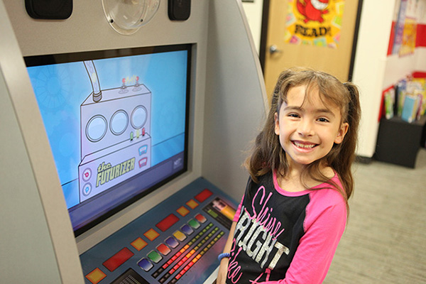 One of the young visitors tries out the traveling exhibit, which has toured libraries and children’s museums across Nebraska.