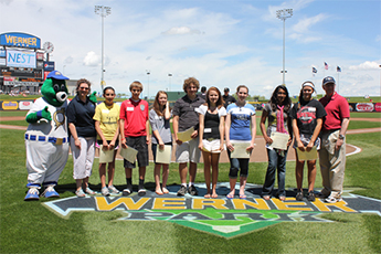 Essay contest winners at home plate.